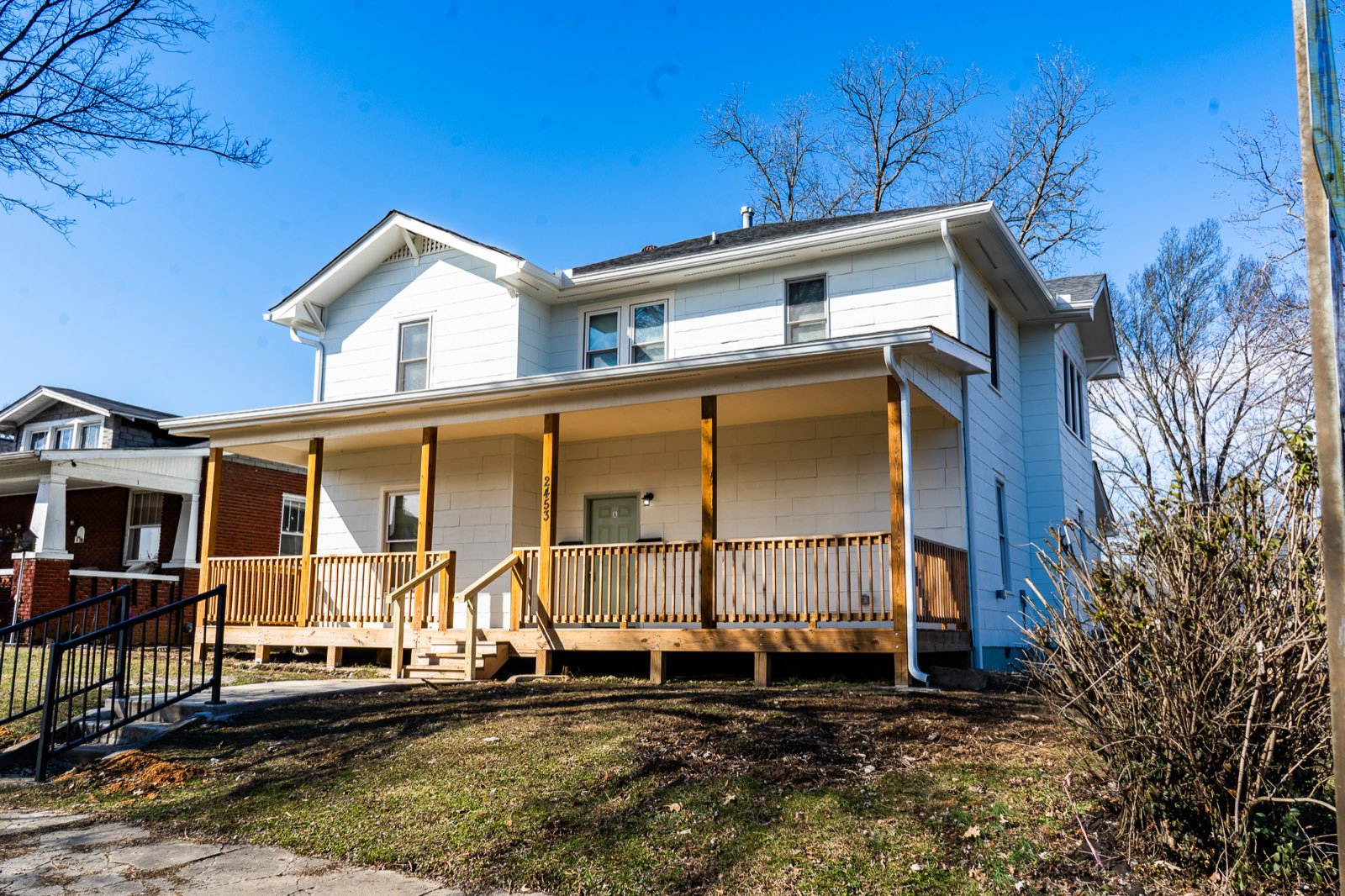Two-story white house with a wide front porch